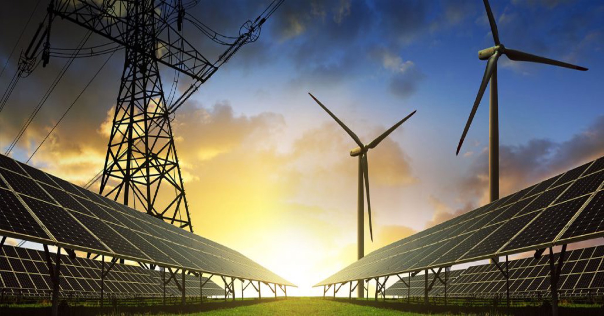 Transmission lines, solar panels, and wind turbines at sunset